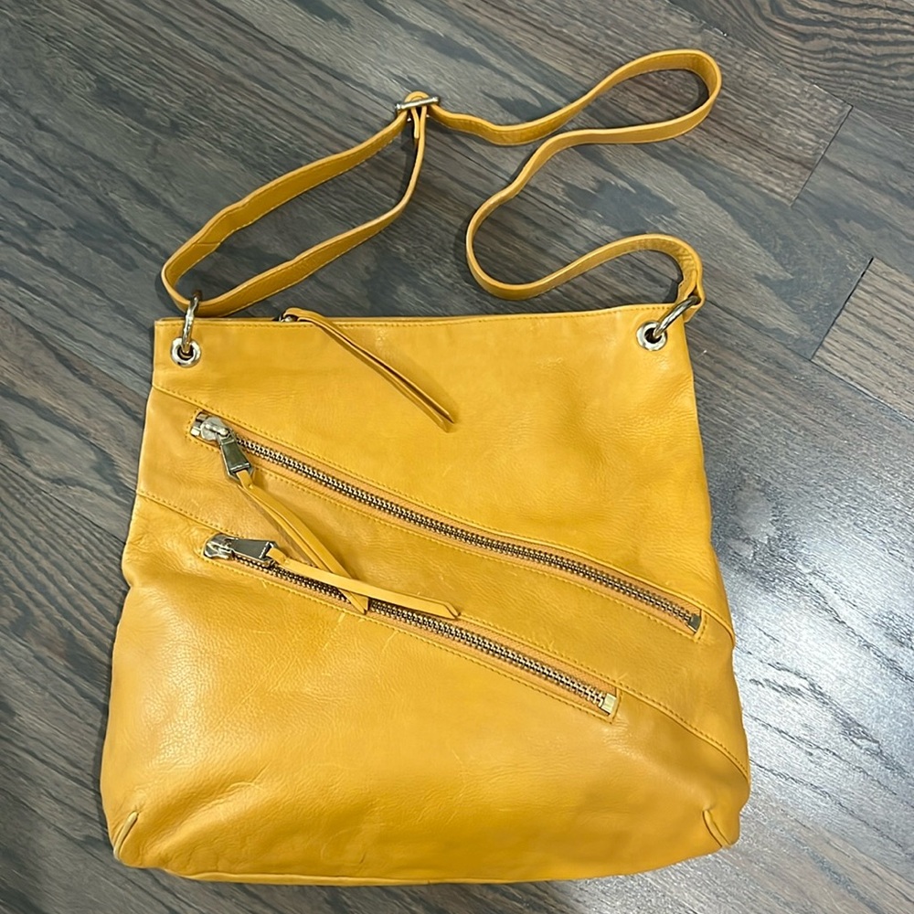 Handbag by Christopher Kon, Butterscotch leather. 15.5” w, 14.25” l, 1” d,
